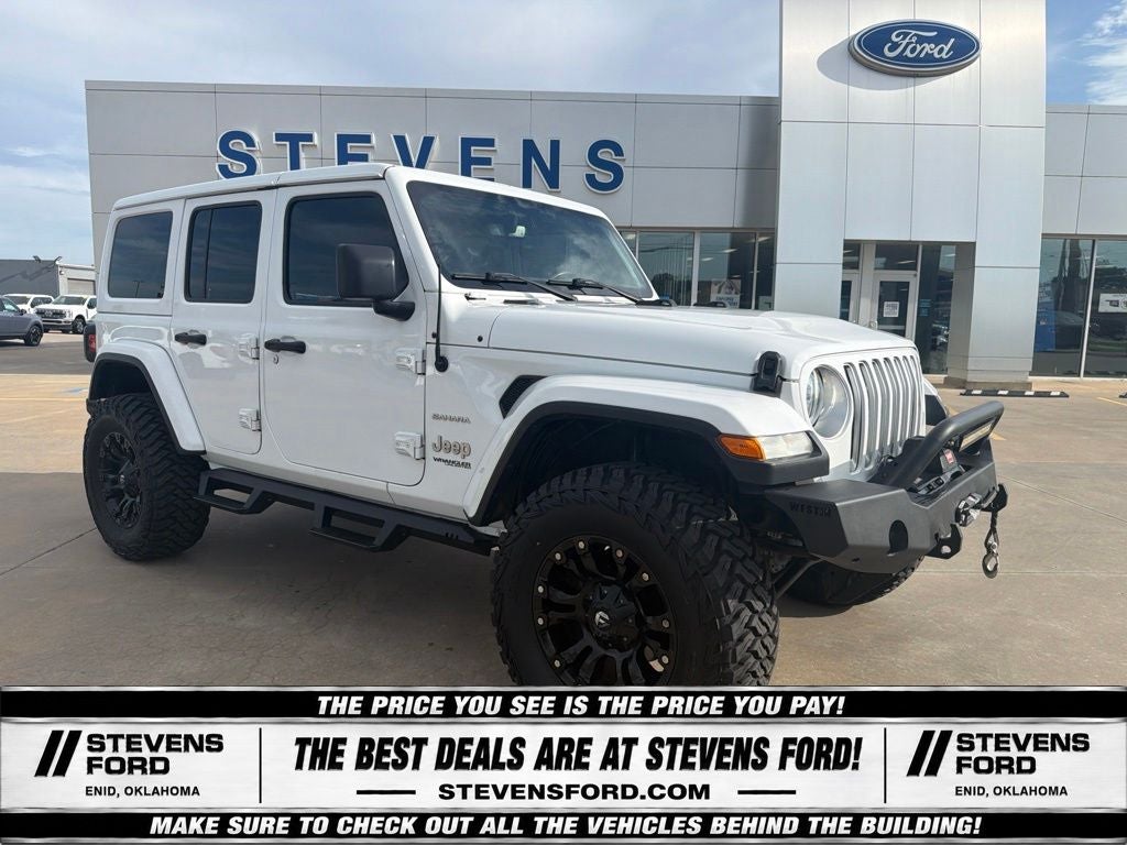 2018 Jeep Wrangler Unlimited Sahara in Bright White Clearcoat — front three-quarter view