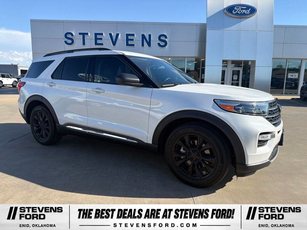 2023 Ford Explorer XLT in White Metallic — front three-quarter view