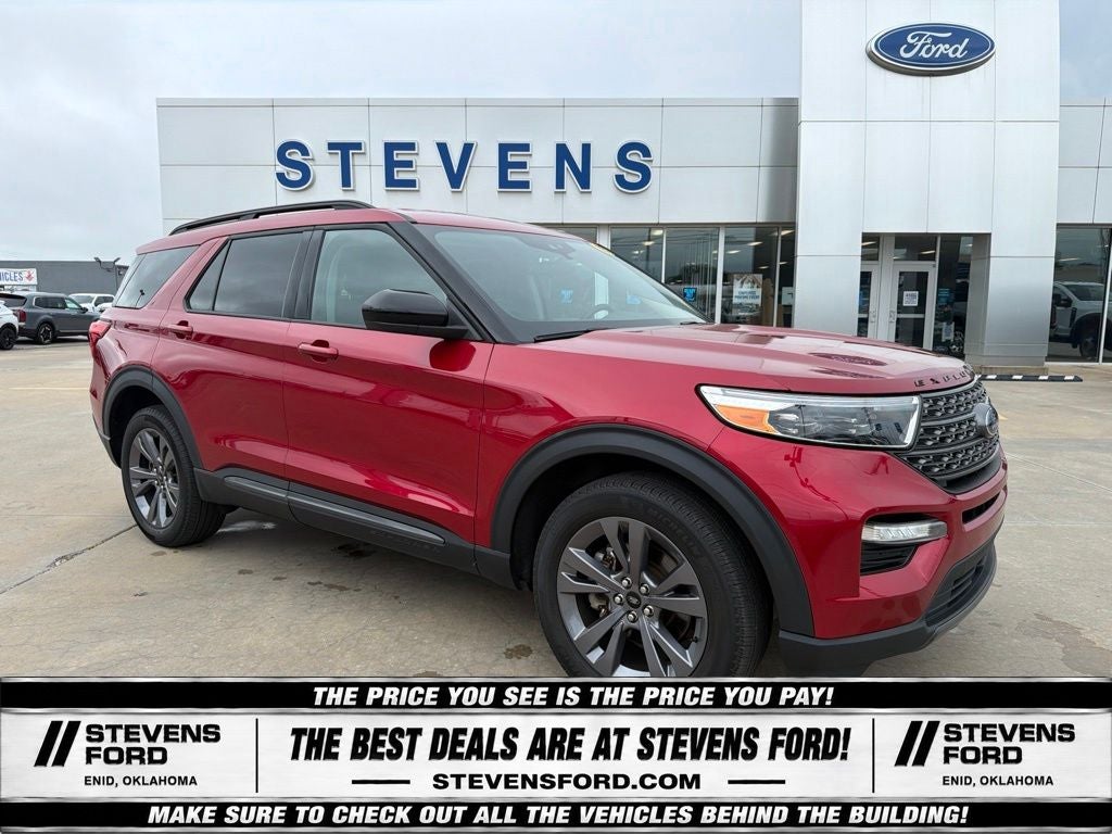 2023 Ford Explorer XLT in Rapid Red Metallic Tinted Clearcoat — front three-quarter view